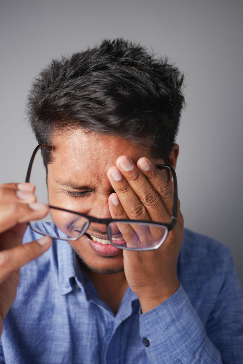 Man Suffering from TMJ Eye Pain Man Suffering from TMJ Eye Pain